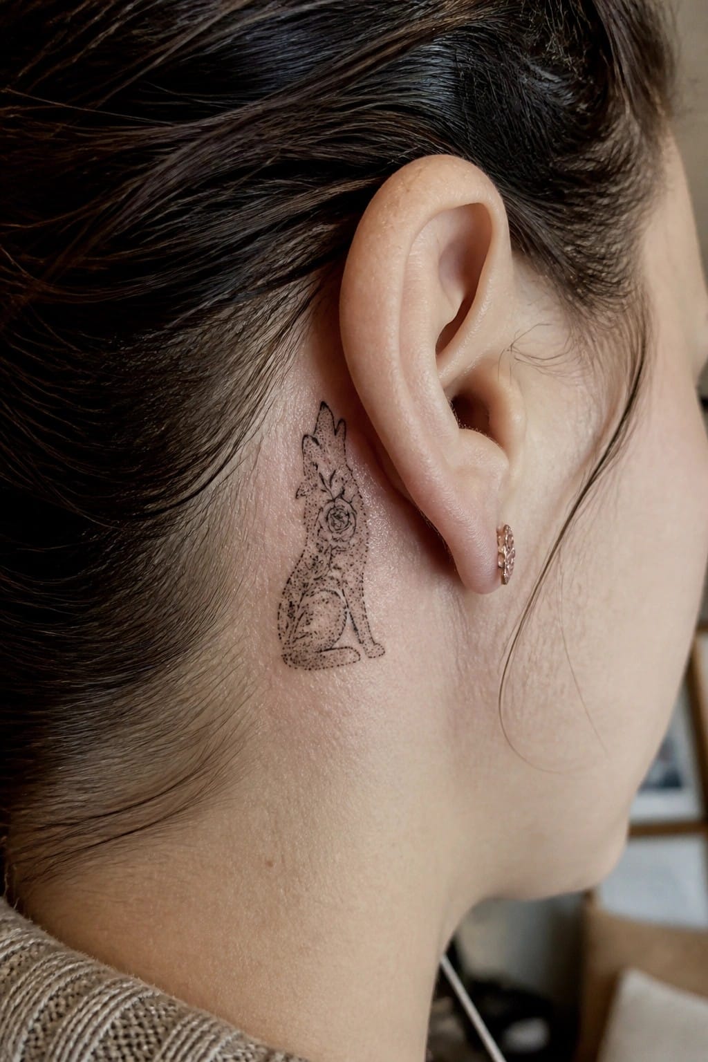 Wolf and rose tattoo behind ear with small stud earring