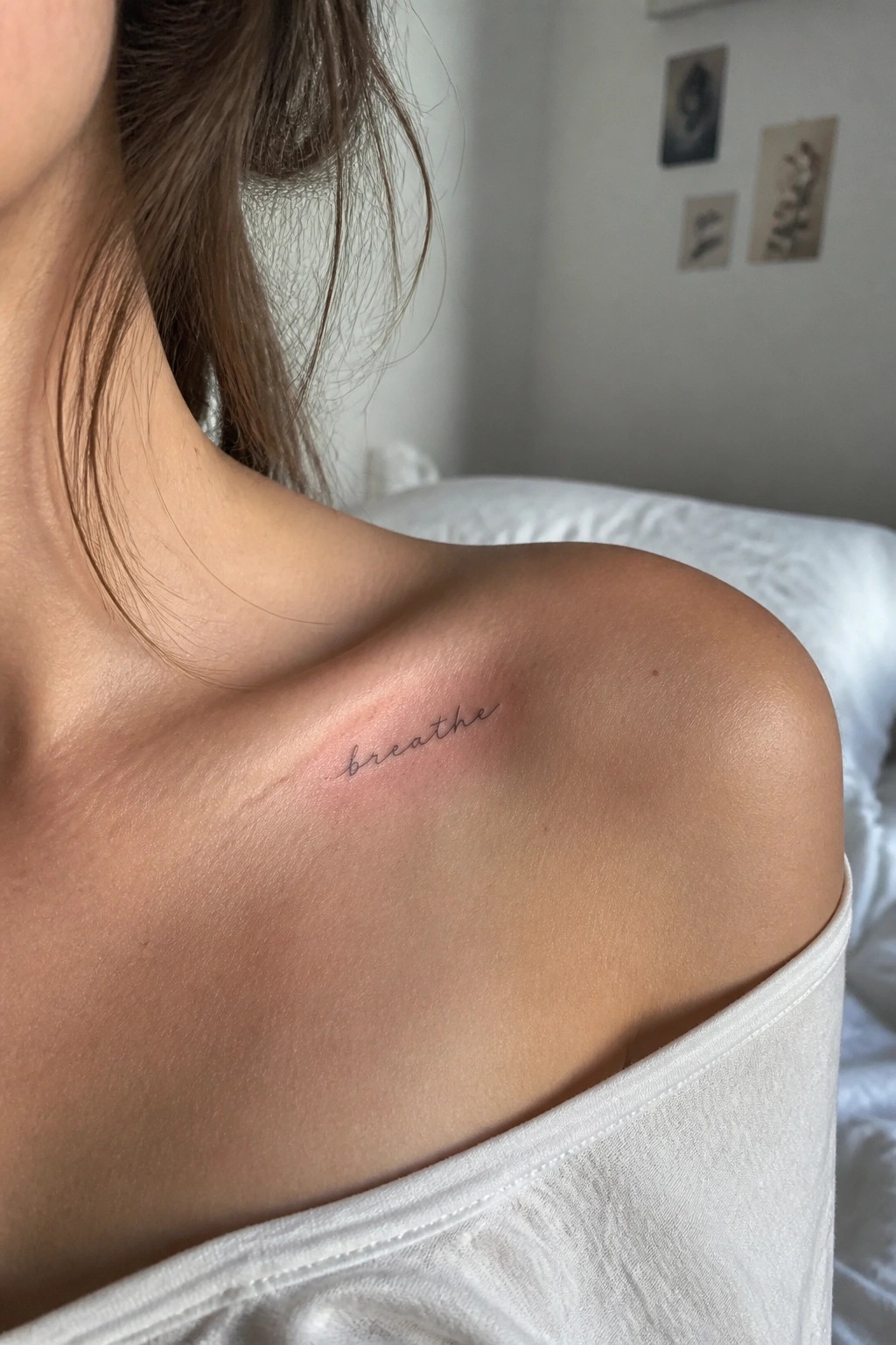 Woman's shoulder with cursive 