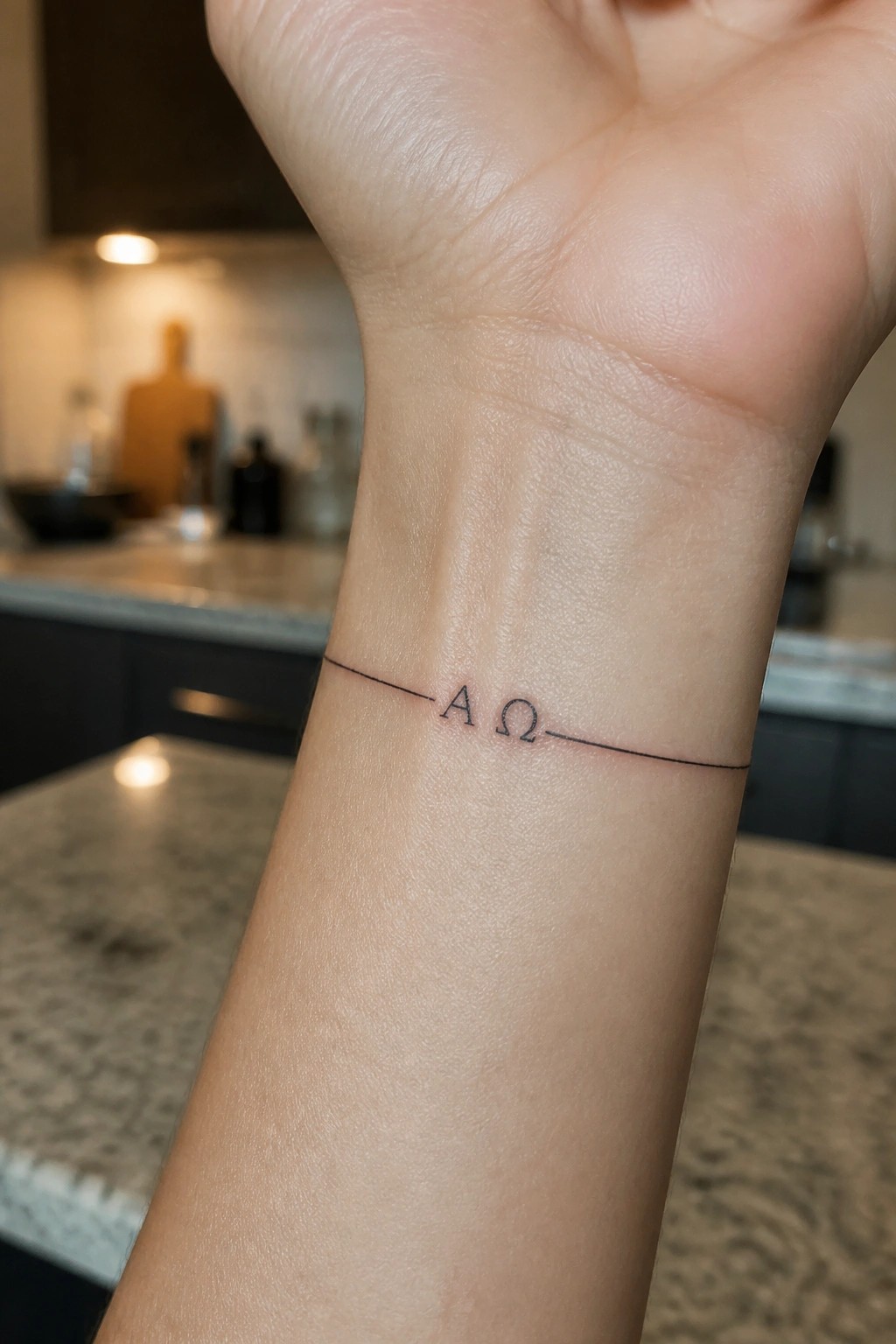 Fine line alpha and omega tattoo with a thin horizontal line on the inner wrist