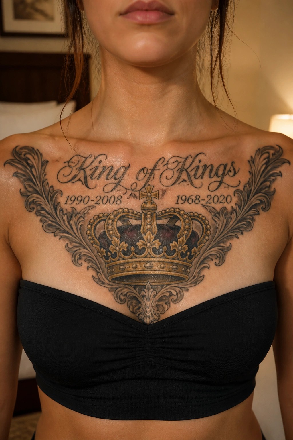 Woman's chest with ornate crown tattoo reading