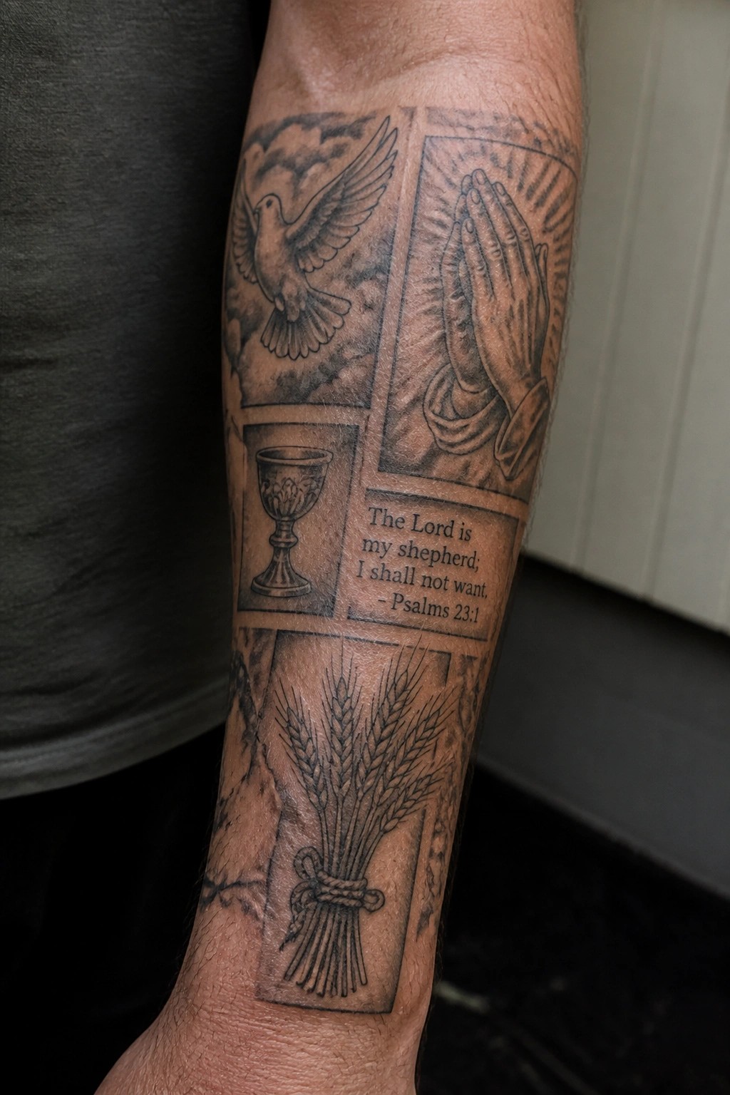 Black and grey patchwork tattoo on a forearm with framed panels showing a dove, praying hands, chalice, wheat sheaf, and Psalm 23 verse.
