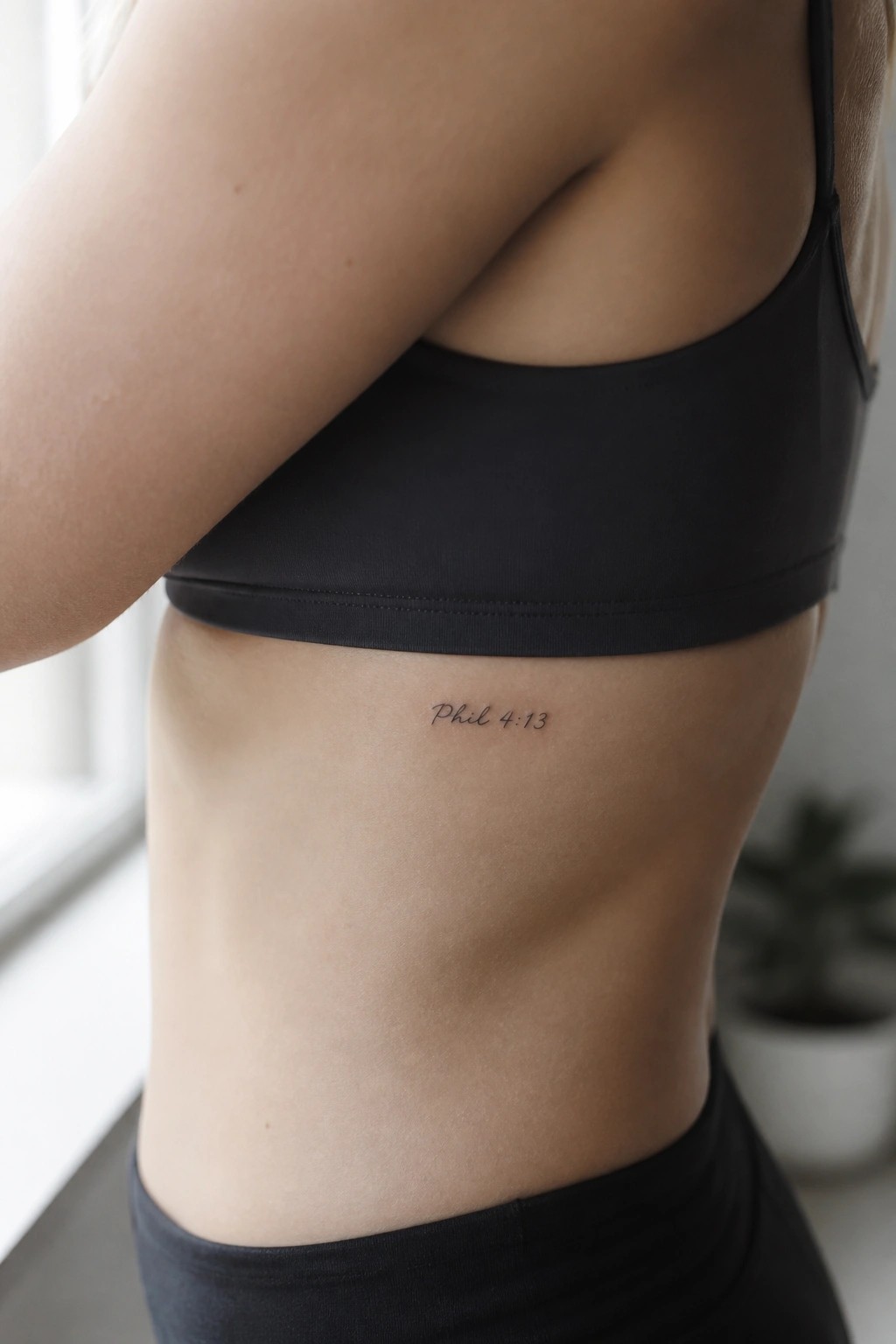 Woman's side torso in black sports bra with