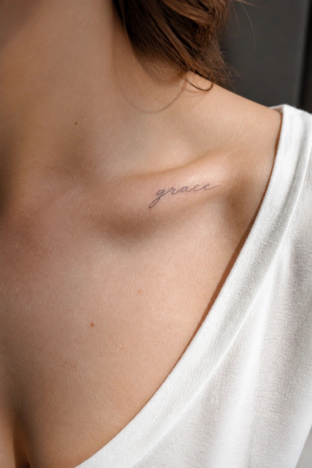 Close-up of shoulder with black cursive