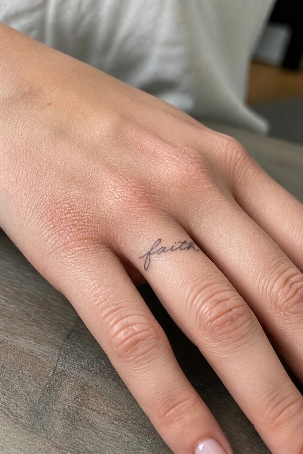 Hand with black cursive