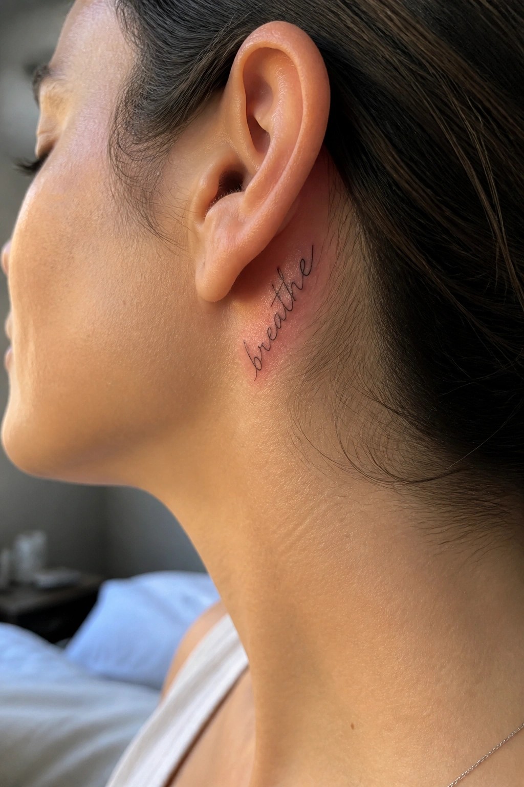 Woman's side profile with cursive