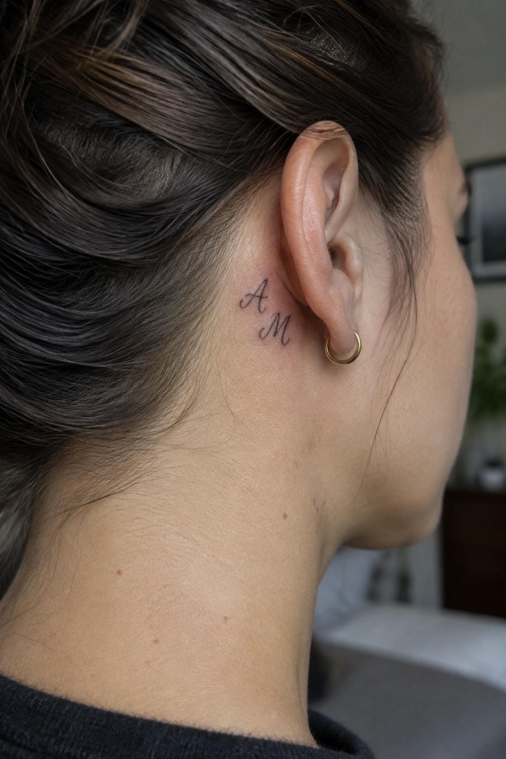 Dark-haired woman with cursive 