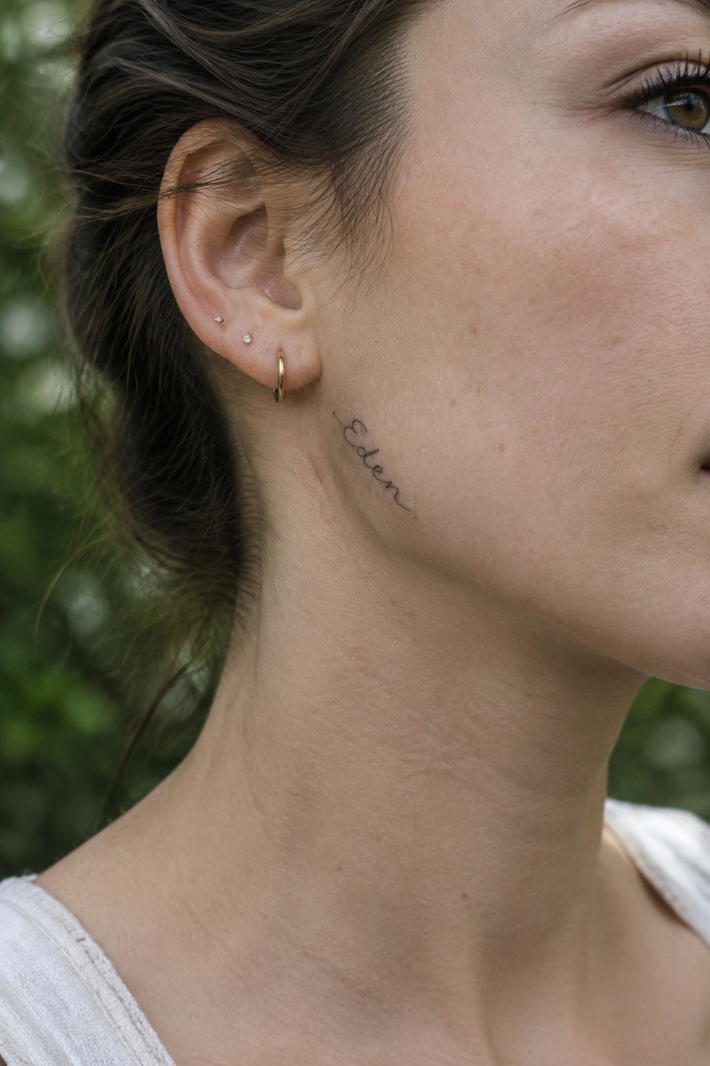 Woman's neck with cursive