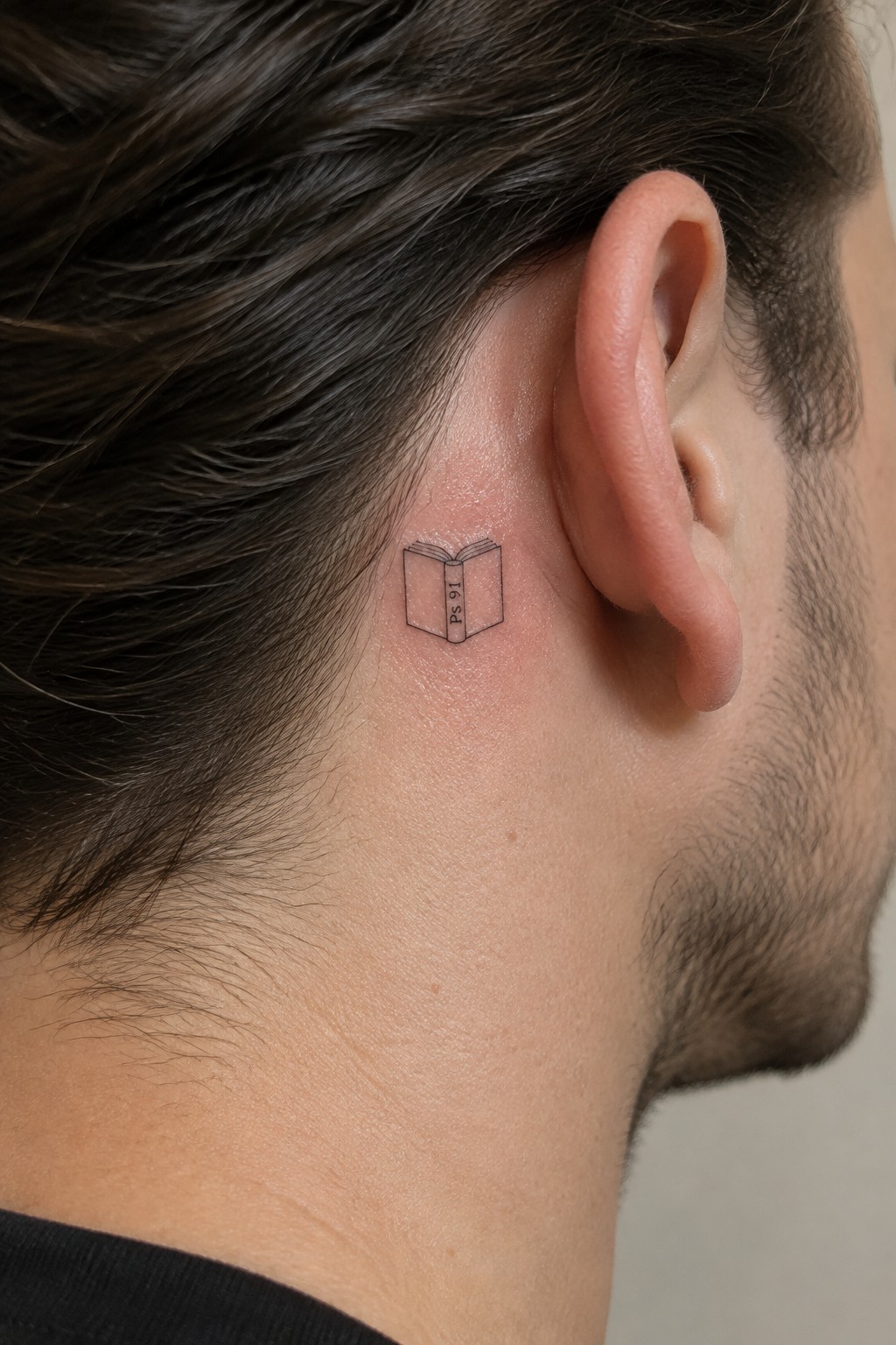 Small open book tattoo with 