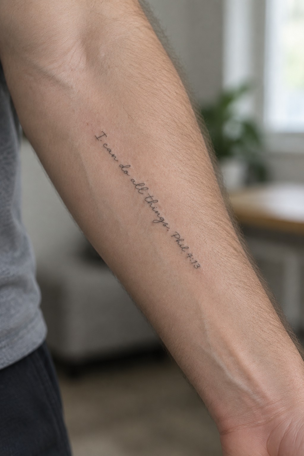 Arm with cursive tattoo 