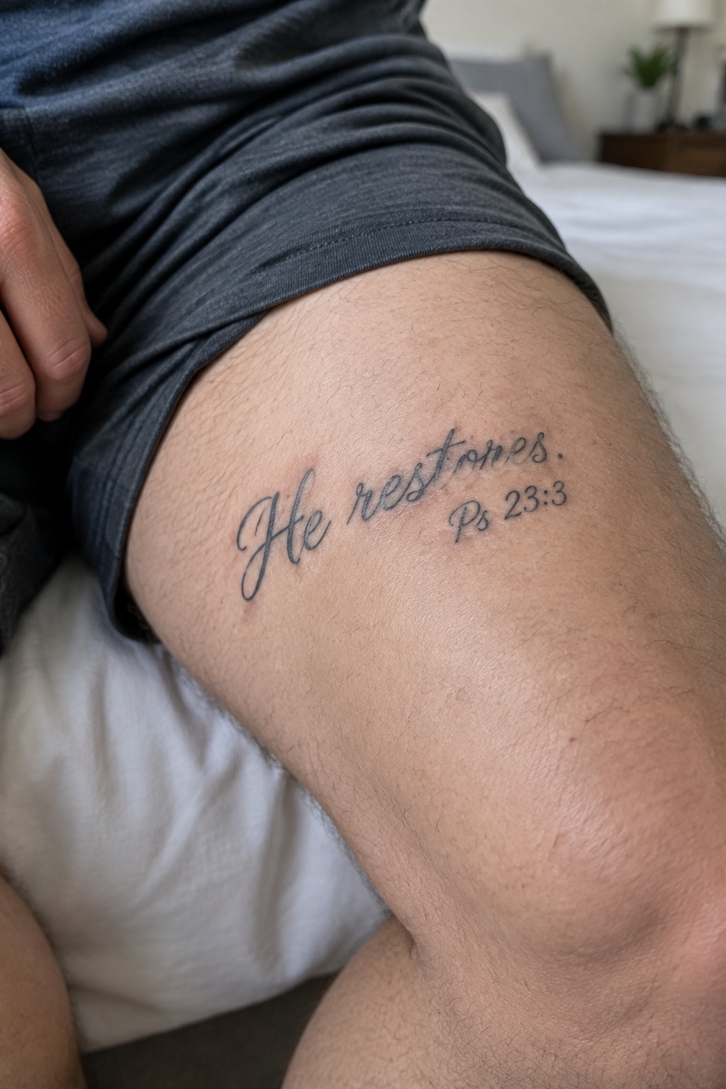 Person's thigh with cursive 