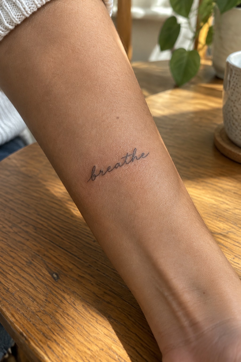 Forearm with black cursive