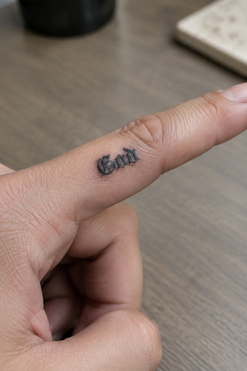 Close-up of index finger with black gothic
