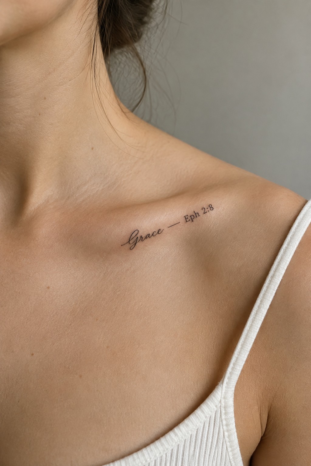 Woman's shoulder with cursive 