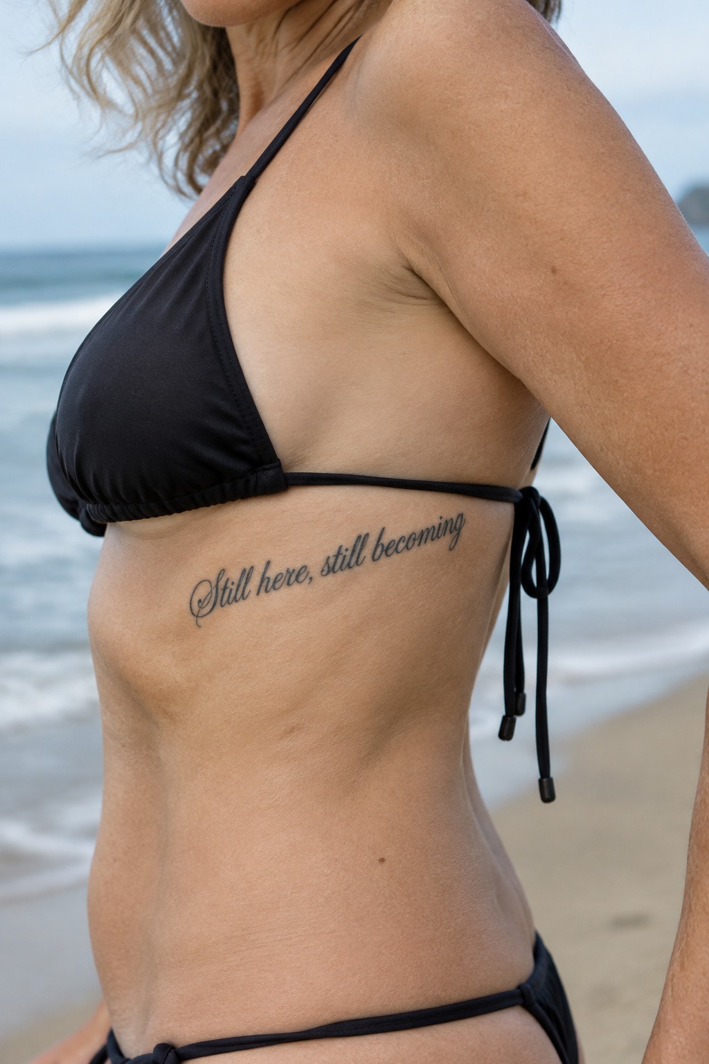 Woman in black bikini with
